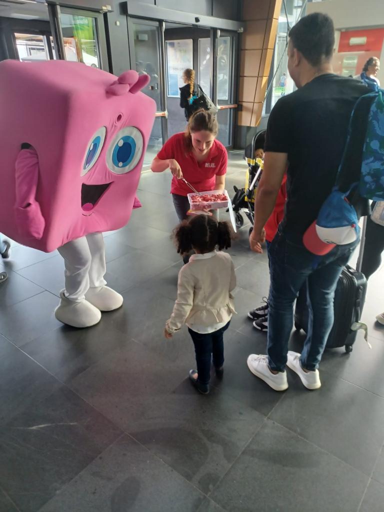 Yolloh mascot doing product sampling