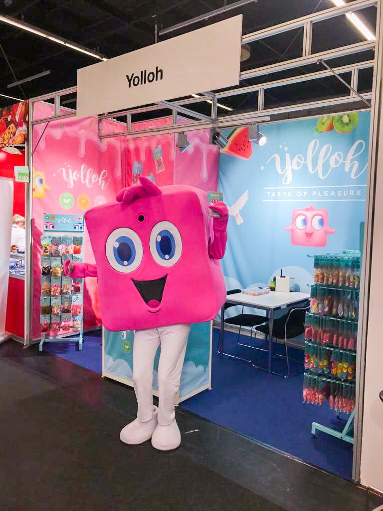 Yolloh mascot at trade show booth